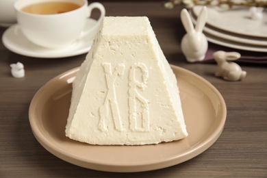 Traditional cottage cheese Easter paskha on wooden table, closeup