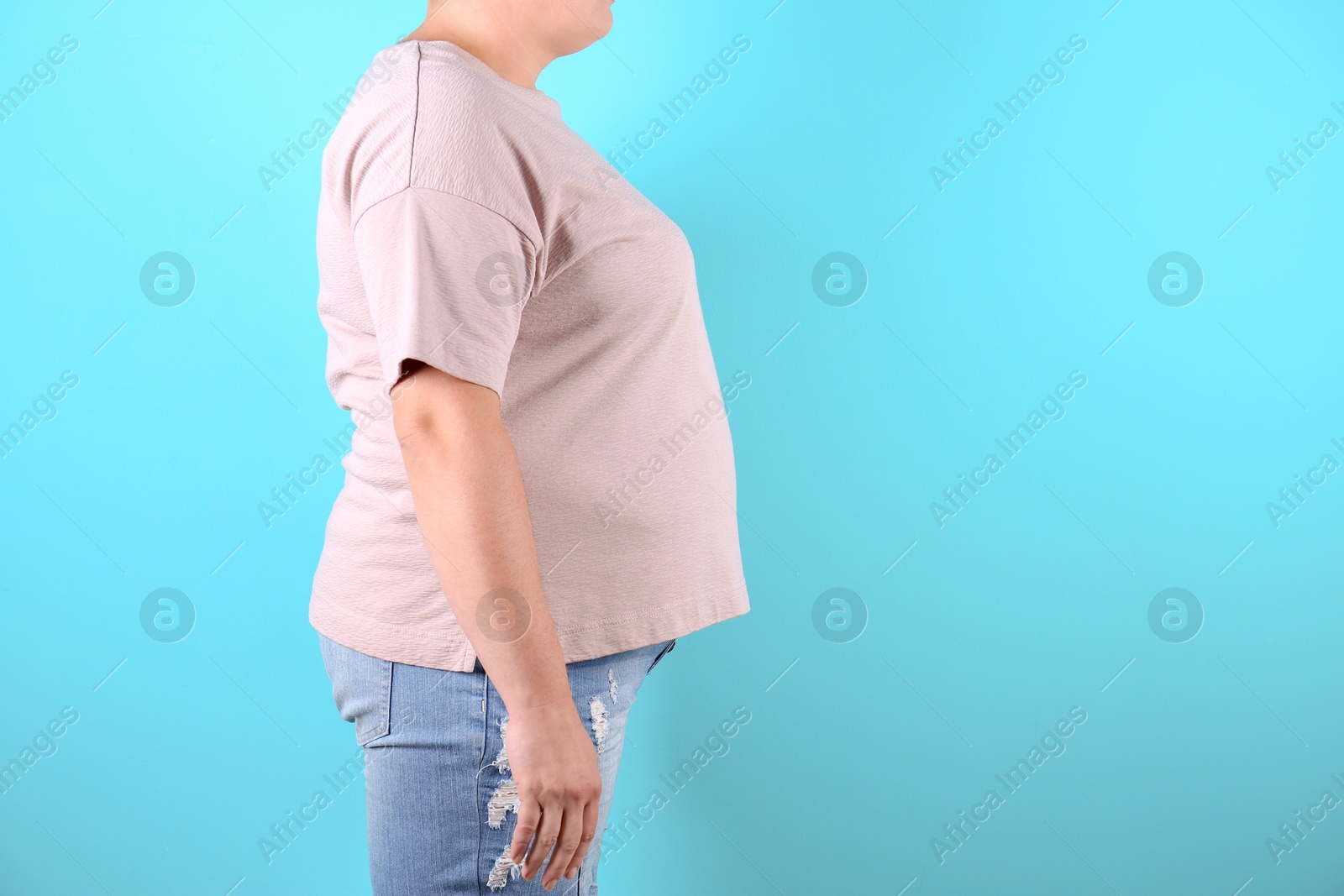 Photo of Fat woman on color background, space for text. Weight loss