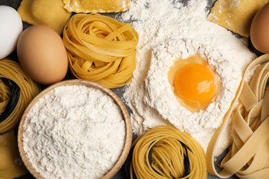 Photo of Different types of pasta and ingredients, top view