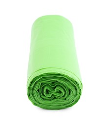 Photo of Roll of light green garbage bags isolated on white