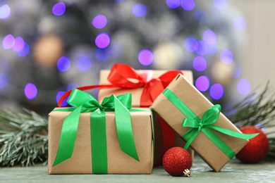 Christmas gifts on table against blurred background