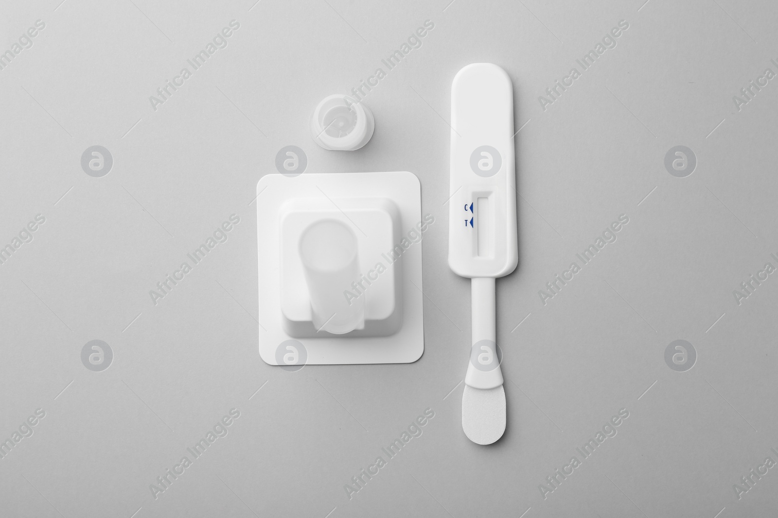 Photo of Disposable express test kit on light grey background, flat lay