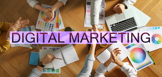 Digital marketing strategy. Team of professionals working together at table, top view