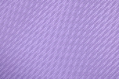 Photo of Stylish violet wallpaper as background, closeup view