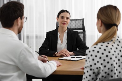 Couple having meeting with lawyer in office