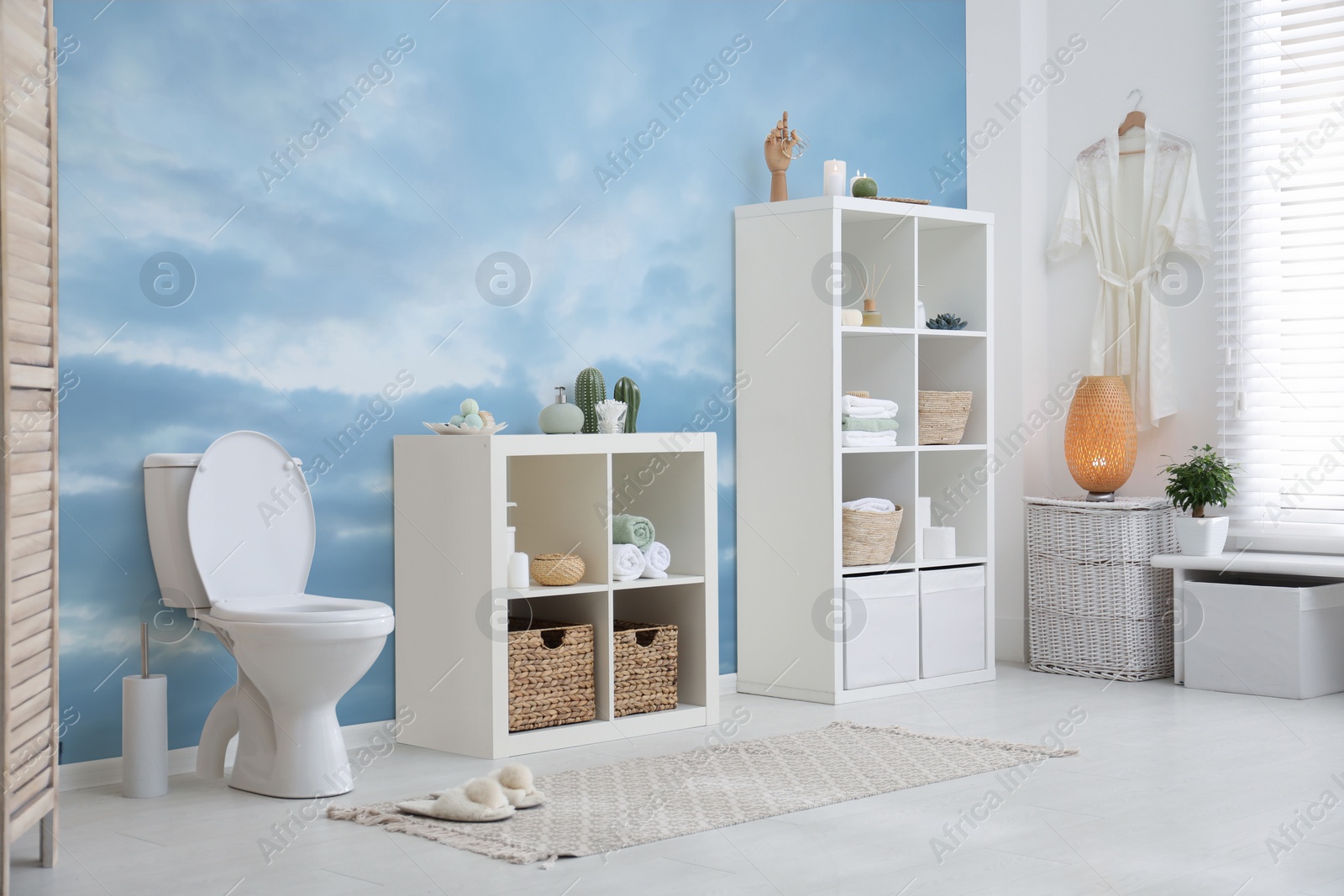 Image of Light bathroom interior with furniture and beautiful wallpapers