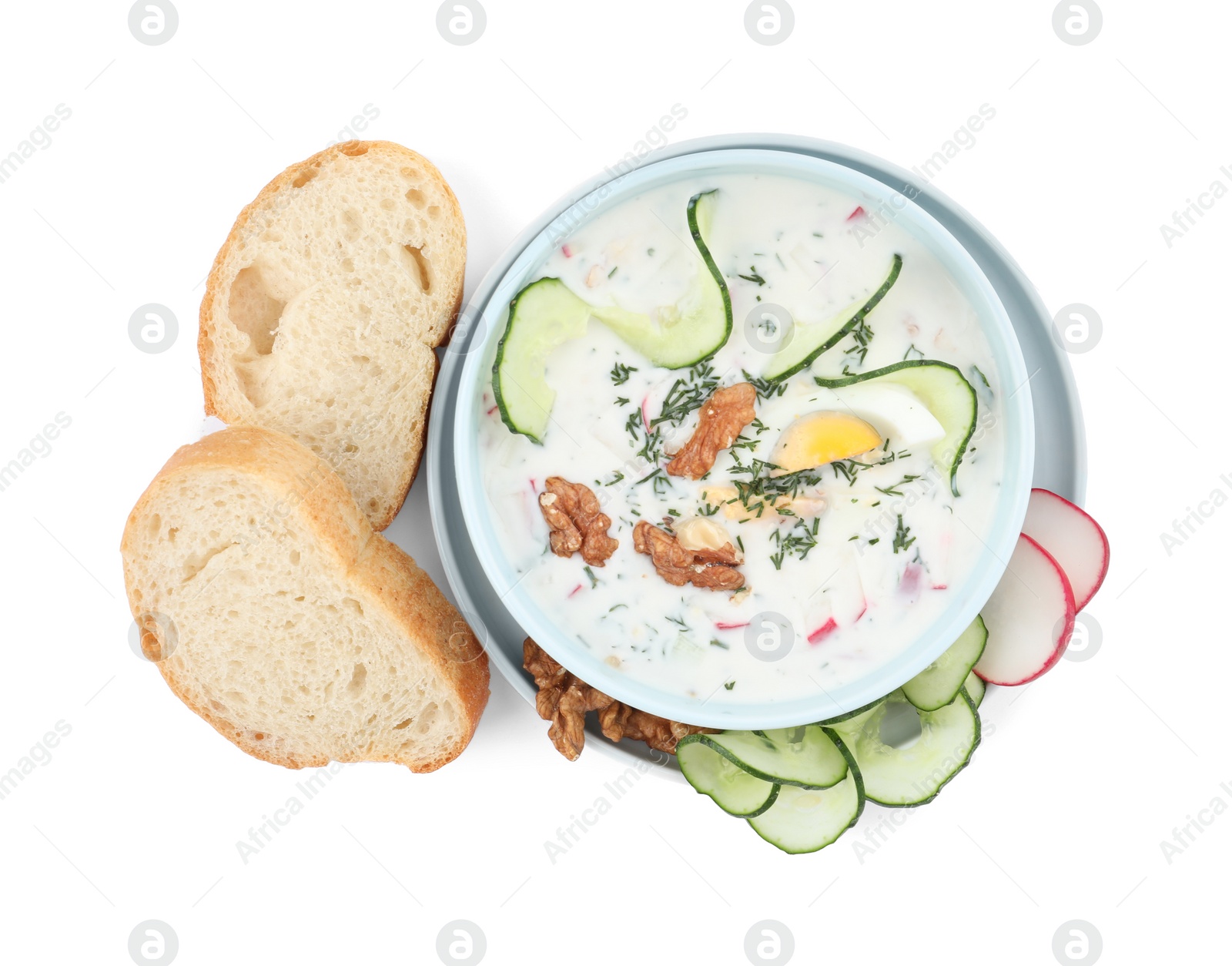 Photo of Delicious cold summer soup and bread on white background, top view