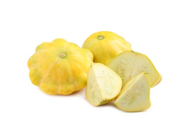 Photo of Whole and cut pattypan squashes on white background