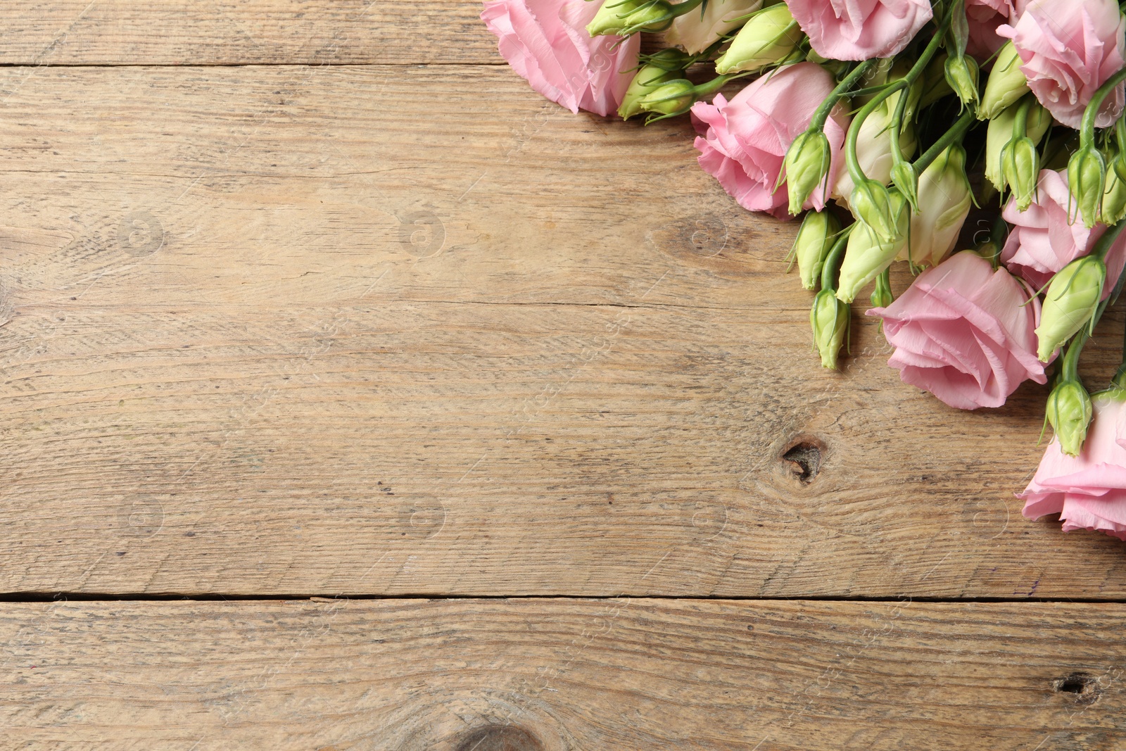 Photo of Happy Mother's Day. Beautiful flowers on wooden table, space for text