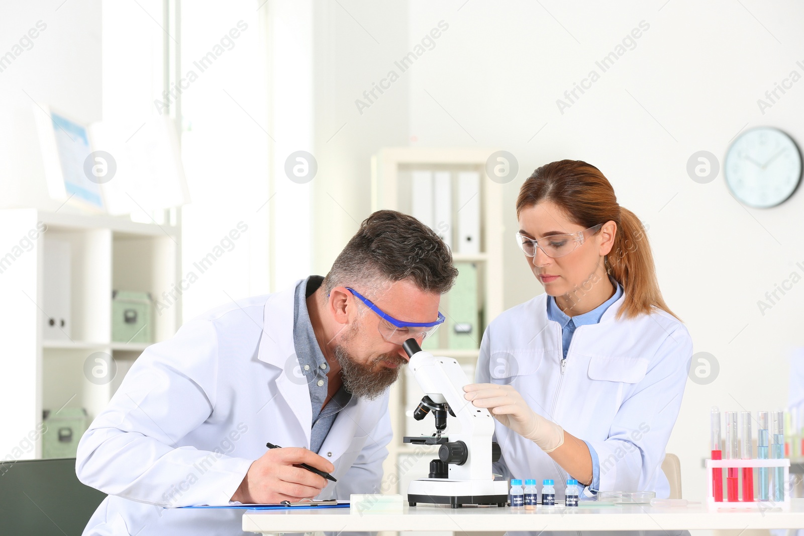 Photo of Scientists working in laboratory. Research and analysis