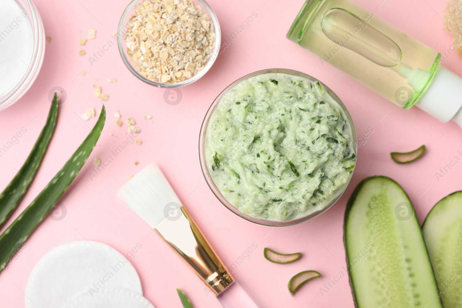 Photo of Flat lay composition with handmade face mask and ingredients on pink background