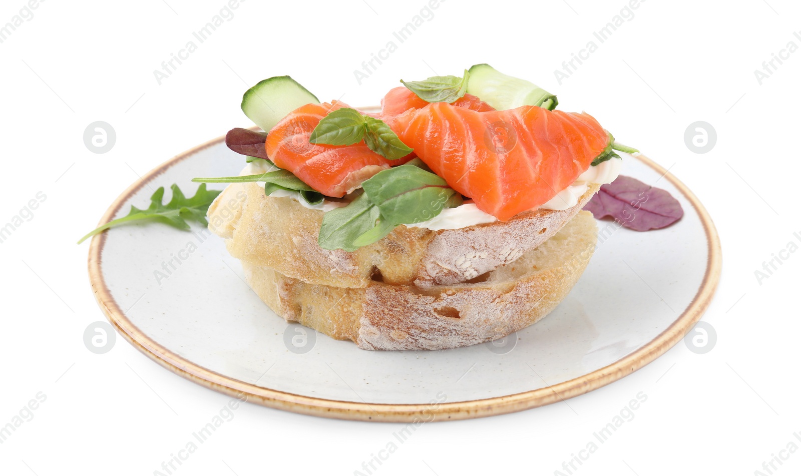 Photo of Tasty bruschetta with salmon, cucumbers and herbs on white background