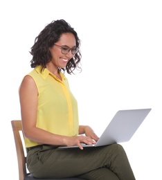 Photo of Happy young woman sitting on chair and working with laptop on white background