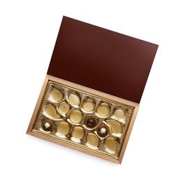 Photo of Partially empty box of chocolate candies isolated on white, top view