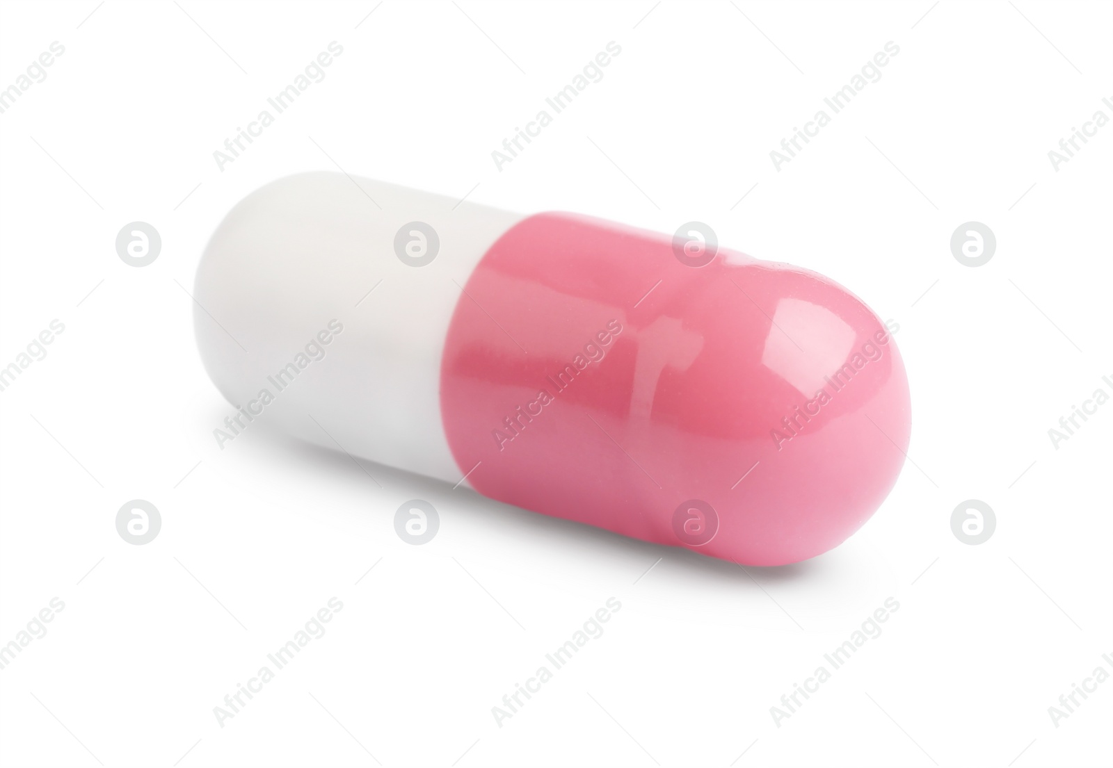 Photo of One pill on white background. Medicinal treatment