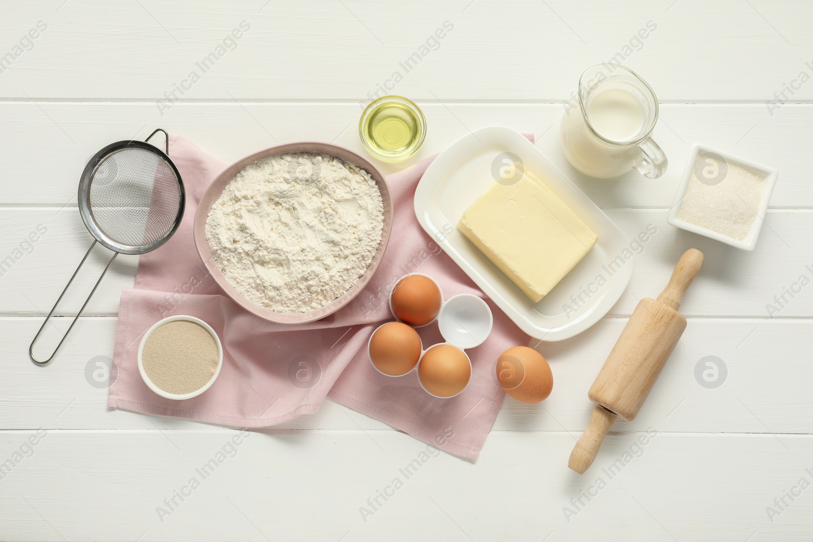 Photo of Flat lay composition with fresh butter and other products on white wooden table