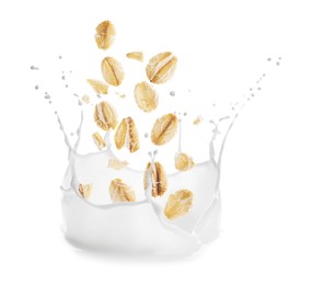 Image of Rolled oats falling into splashing milk on white background