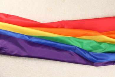 Photo of Rainbow LGBT flag on white background, closeup