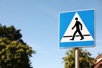 Pedestrian crossing road sign on city street. Space for text