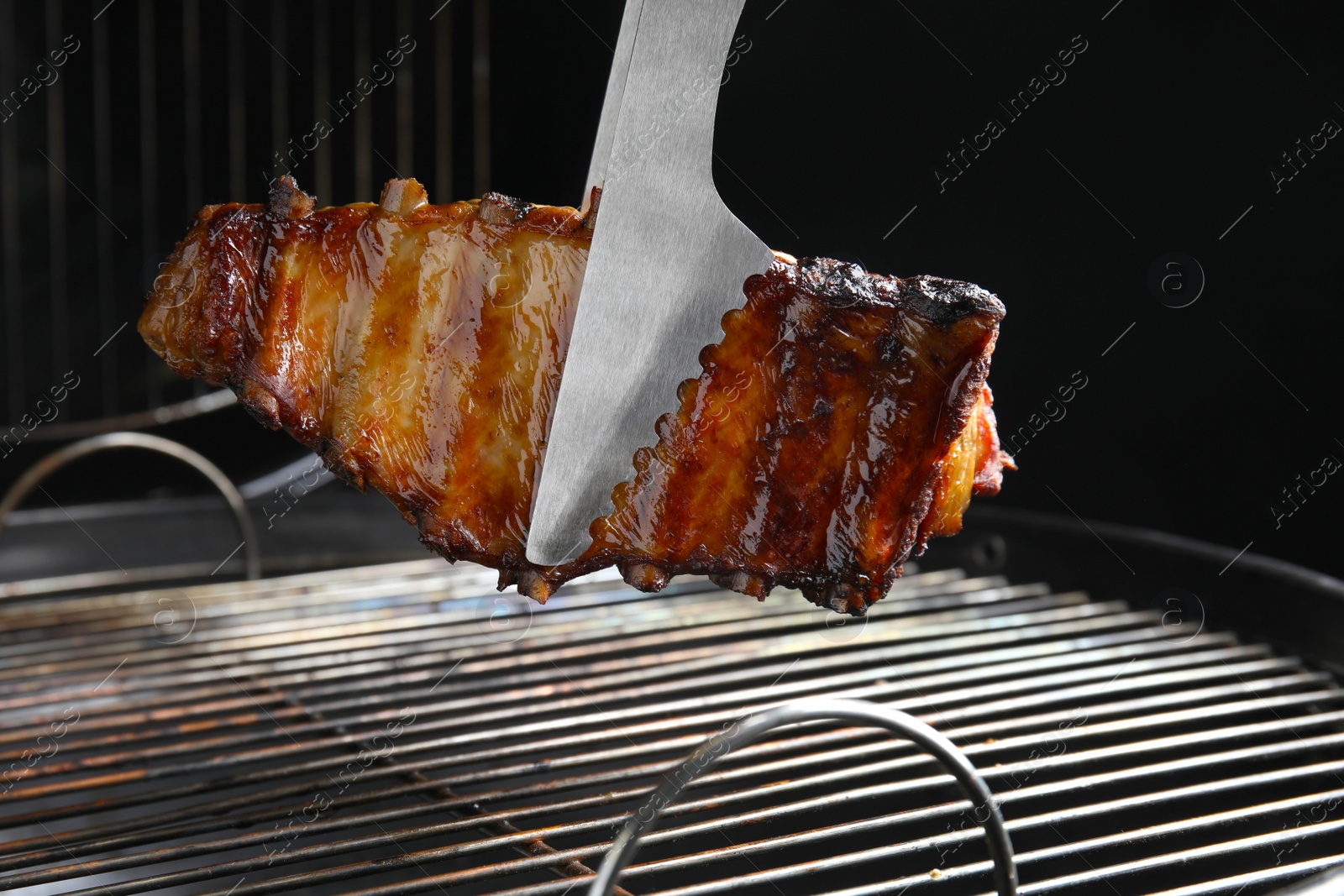 Photo of Delicious ribs on barbecue grill. Yummy meat