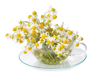 Photo of Aromatic herbal tea in glass cup with chamomile flowers isolated on white