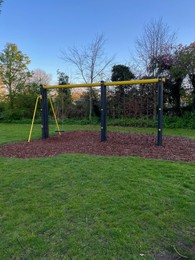 Photo of Swing and climbing net on children's playground in park