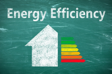 Image of Energy efficiency concept. Part of house and colorful chart drawn on chalkboard