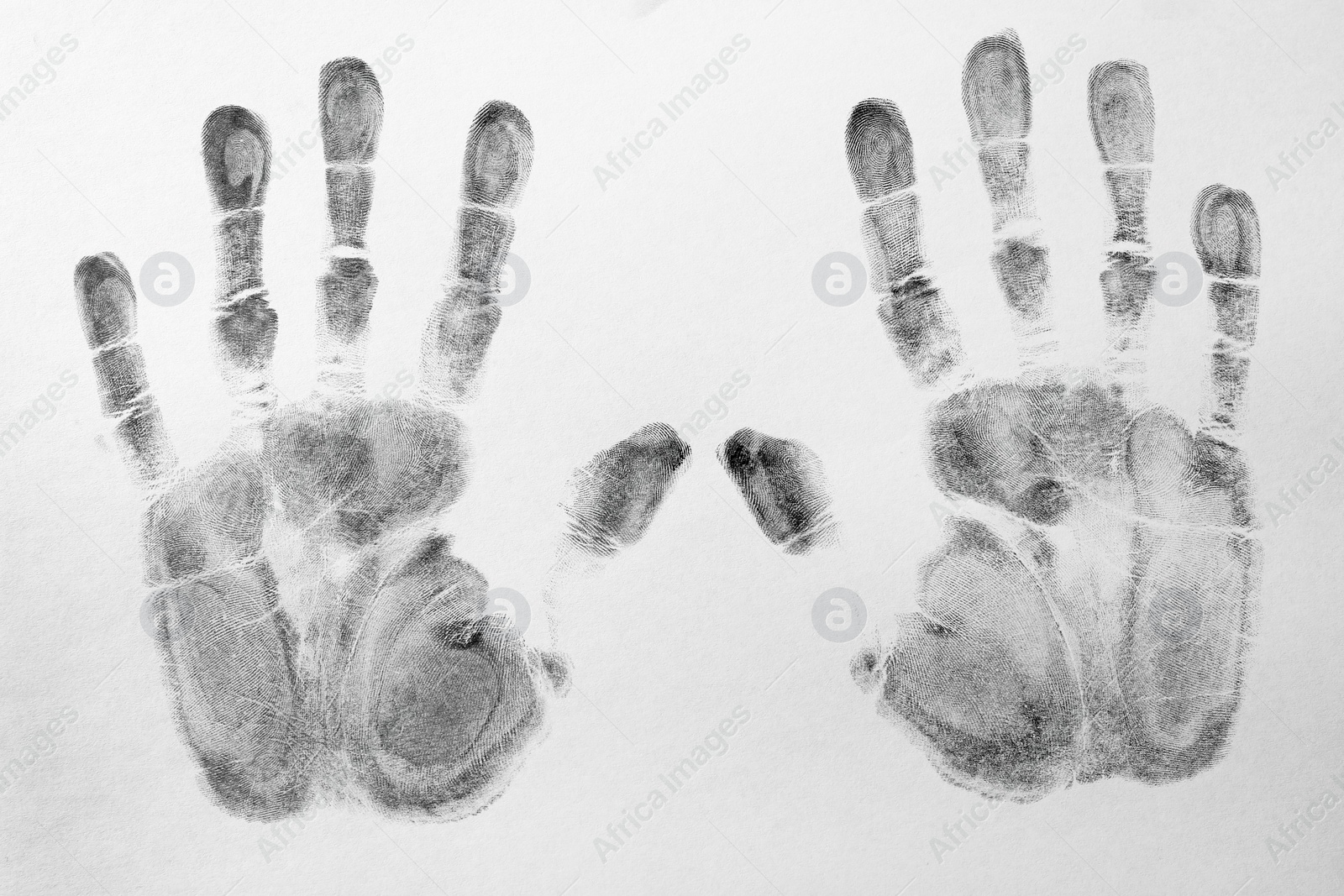 Photo of Print of hands and fingers on white background, top view