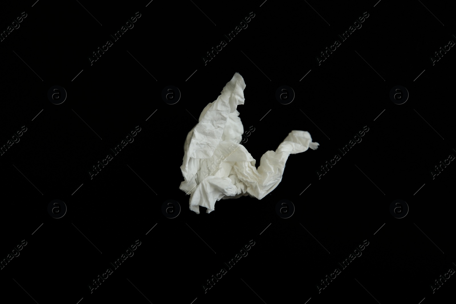 Photo of Used paper tissue on black background, top view