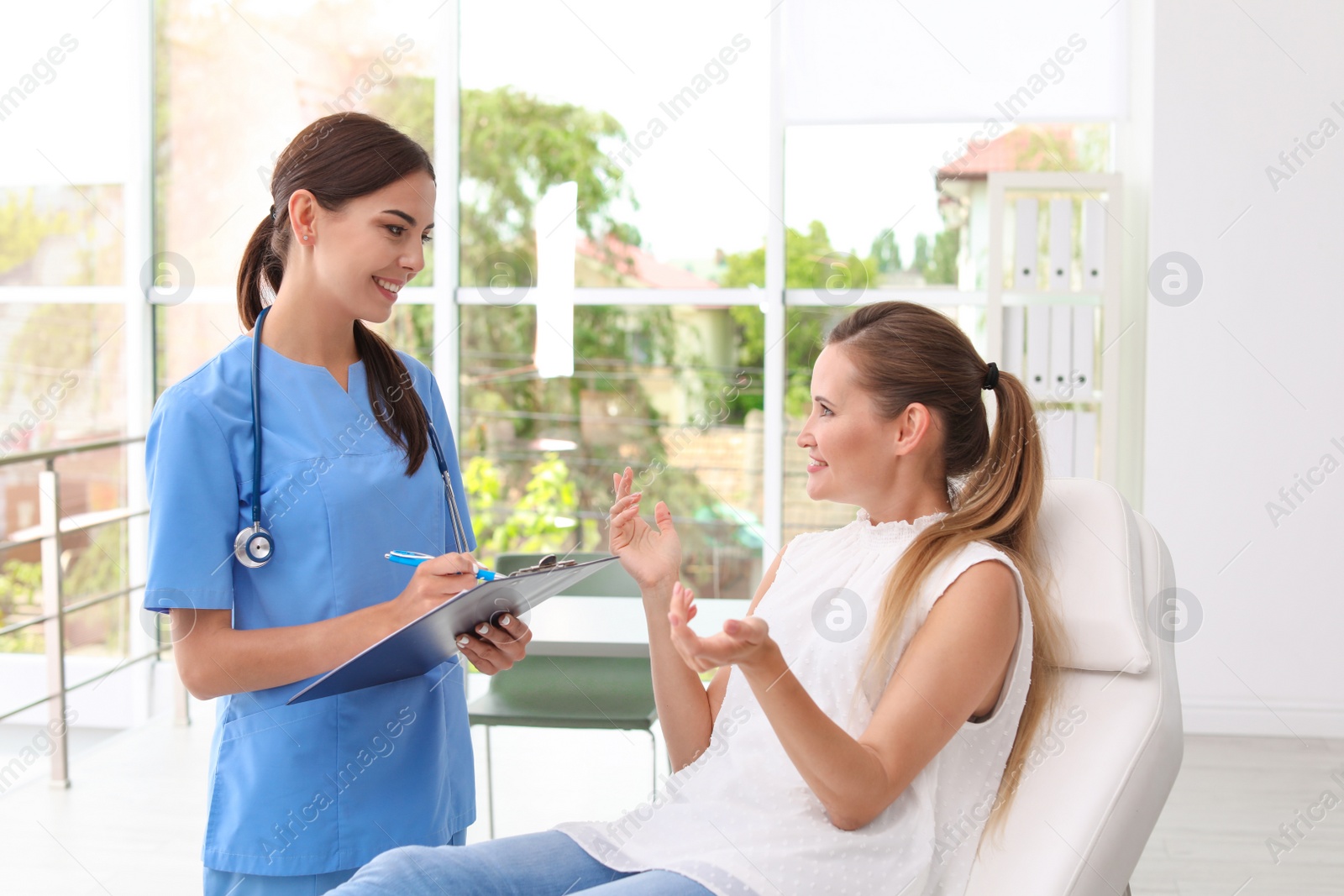 Photo of Patient having appointment with doctor in hospital