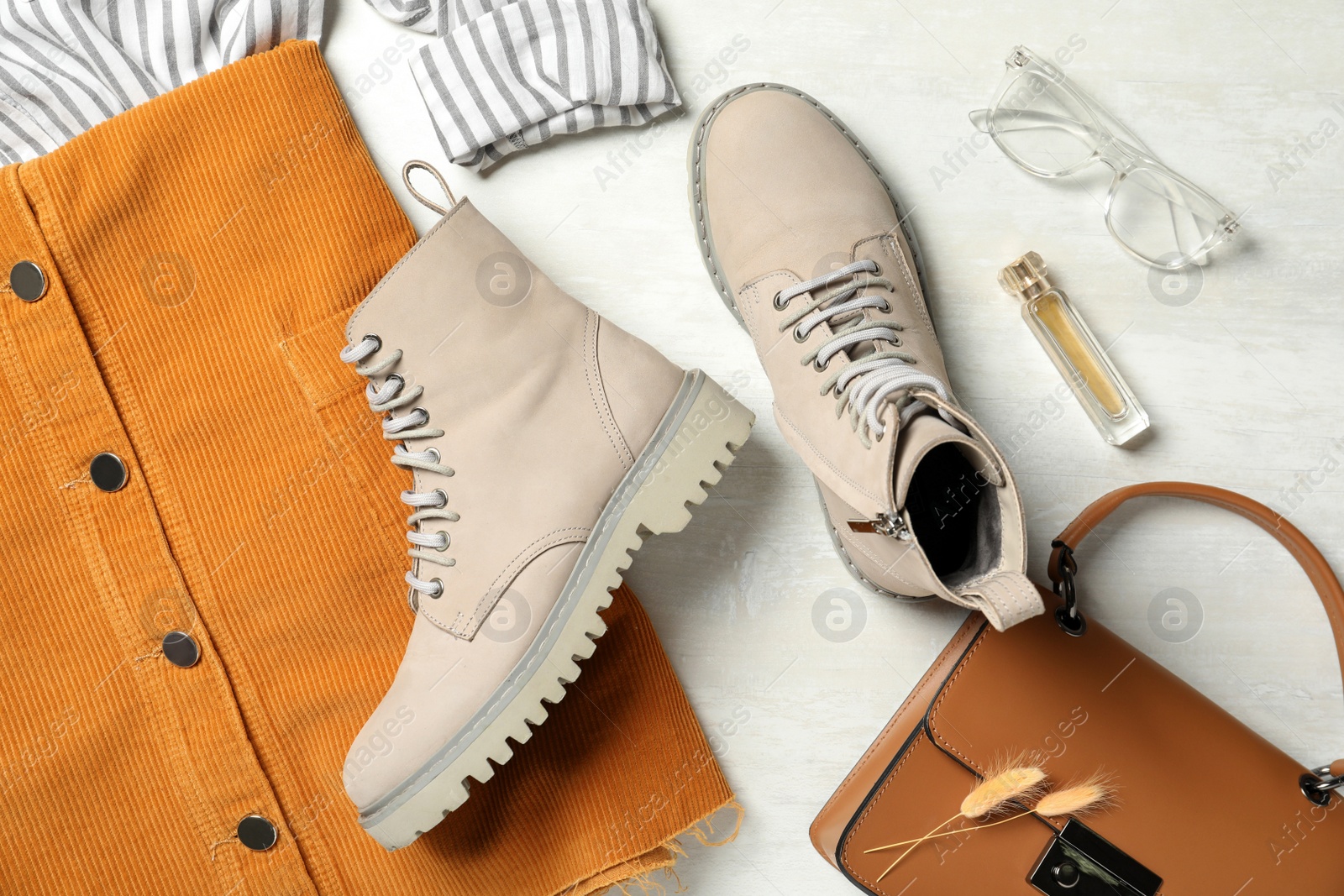 Photo of Flat lay composition with stylish boots on white background