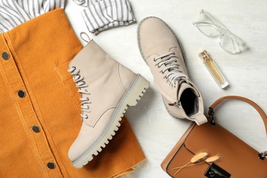 Photo of Flat lay composition with stylish boots on white background
