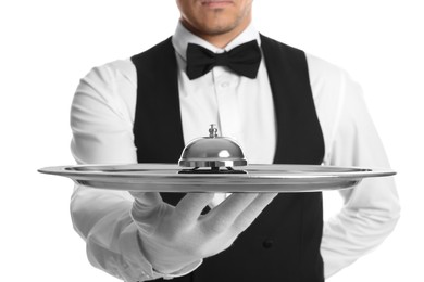 Butler holding metal tray with service bell on white background, closeup