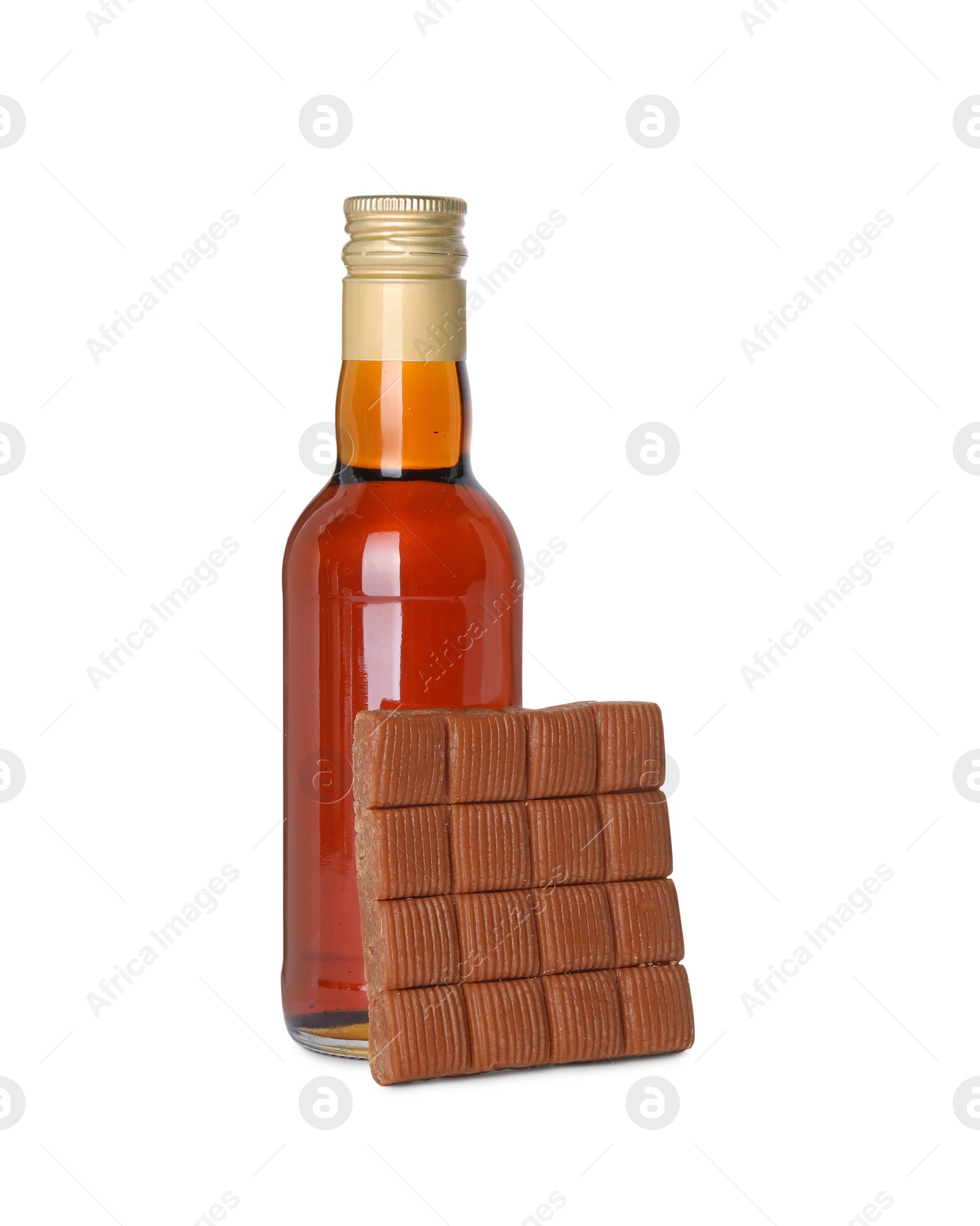 Photo of Bottle of delicious syrup for coffee and caramel candies isolated on white