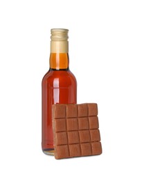 Photo of Bottle of delicious syrup for coffee and caramel candies isolated on white