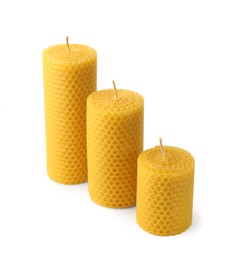 Photo of Stylish elegant beeswax candles isolated on white
