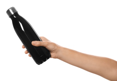 Woman holding black thermos bottle on white background, closeup