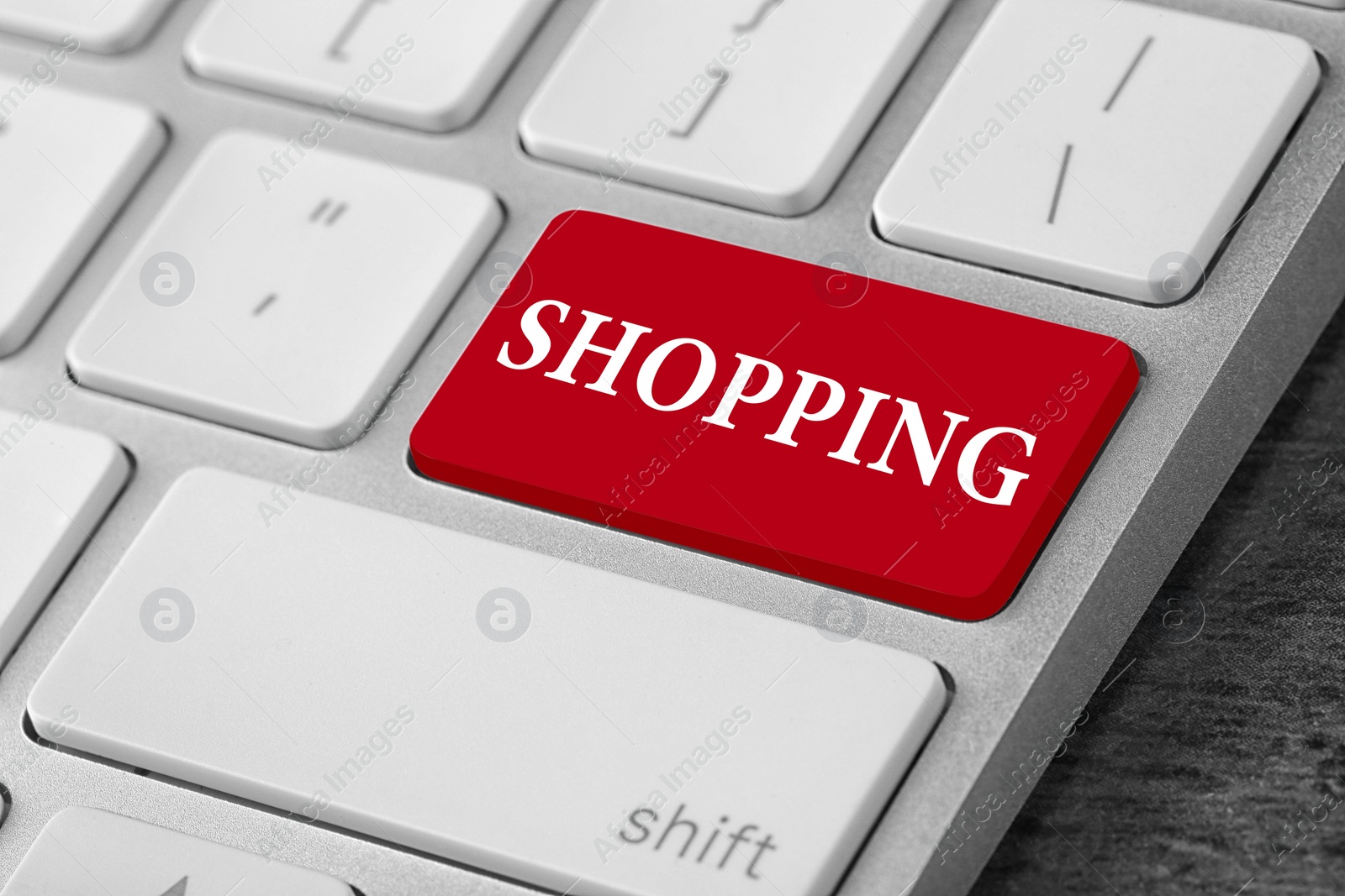 Image of Online store. Red button with word SHOPPING on computer keyboard, closeup