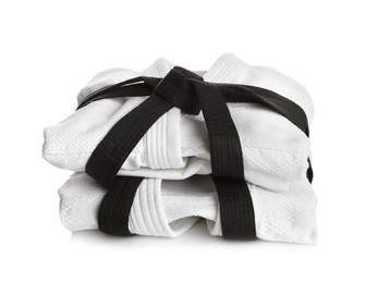 Photo of Martial arts uniform with black belts on white background