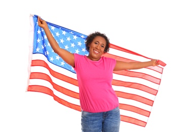 Portrait of happy African-American woman with USA flag on white background