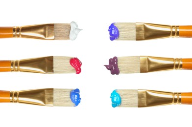 Set of different brushes with paints on white background