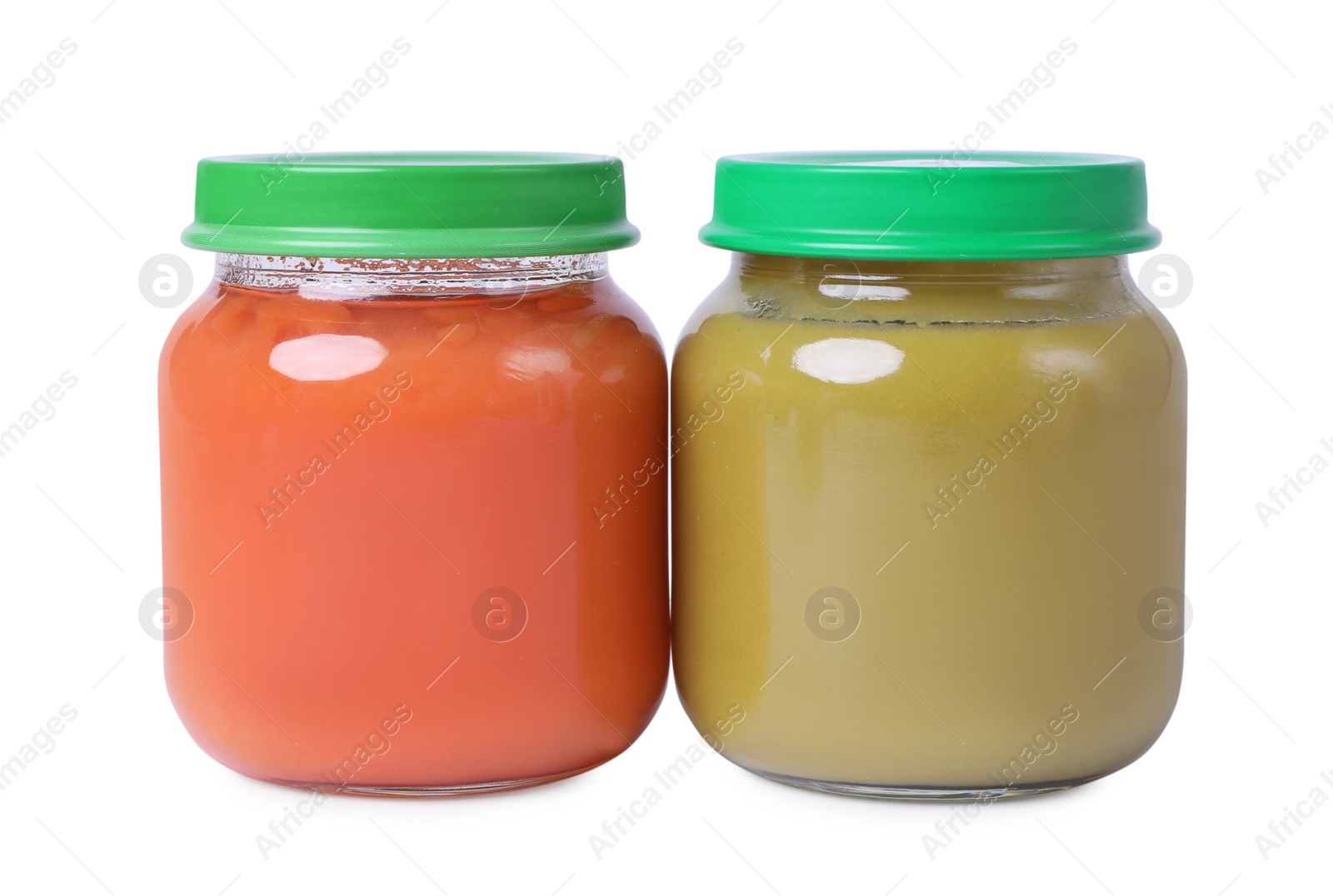 Photo of Glass jars with healthy baby food isolated on white