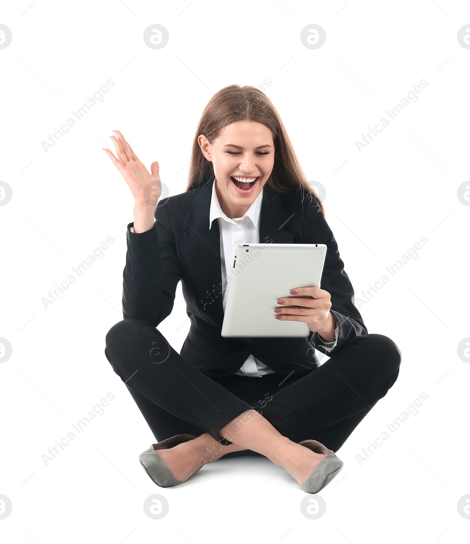 Photo of Emotional businesswoman in office wear with tablet celebrating victory on white background