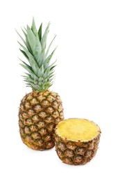 Photo of Whole and cut tasty ripe pineapples isolated on white