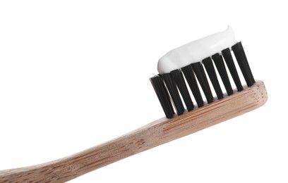 Photo of Wooden brush with toothpaste isolated on white, closeup