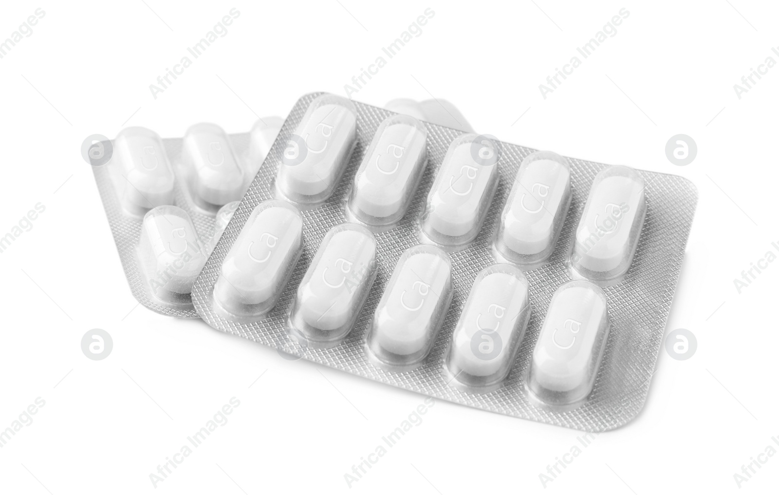 Photo of Calcium supplement pills in blister packs on white background