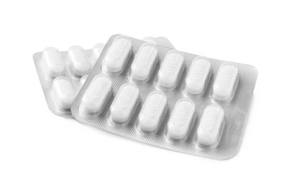 Photo of Calcium supplement pills in blister packs on white background