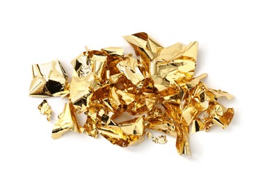 Photo of Many pieces of edible gold leaf isolated on white, top view