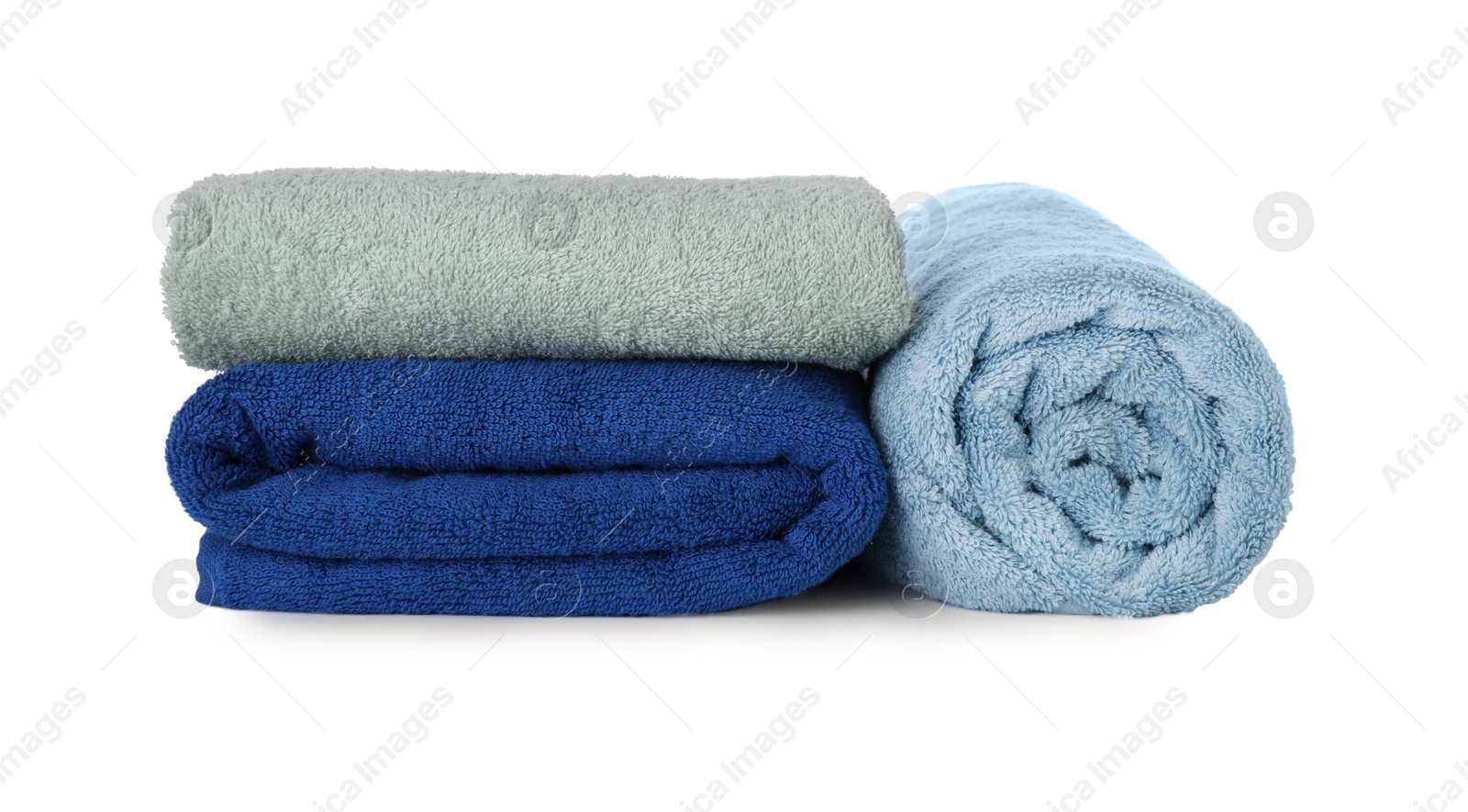 Photo of Fresh clean towels for bathroom on white background