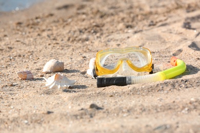 Photo of Set for snorkeling on sand. Beach object